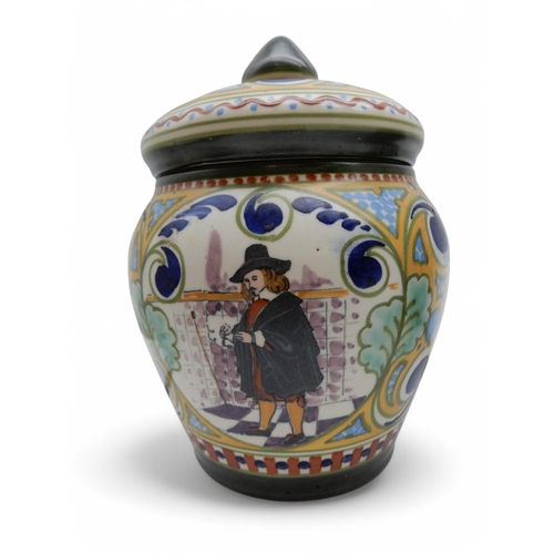 192 - A Moorcroft lamp in Clematis pattern, another in Hibiscus pattern together with a Gouda tobacco jar ... 