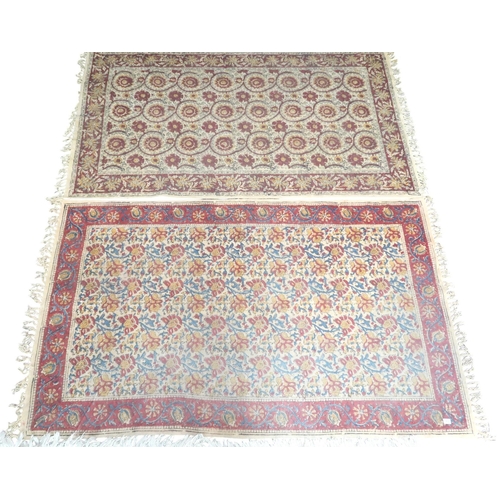 72 - A lot comprising a blue and red geometric patterned ground rug, pair of beige ground rugs and two fl... 