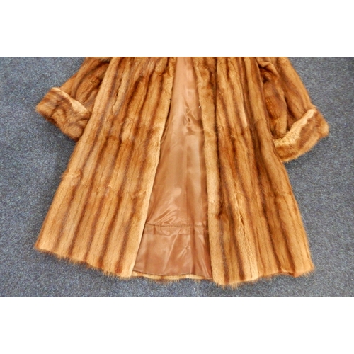 246 - A long brown fur coat