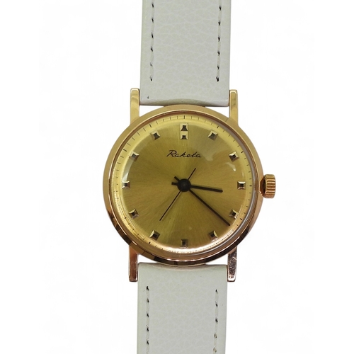 A 14K GOLD RUSSIAN RAKETA WATCHin rose gold with a brushed yellow gold ...
