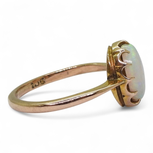 2726 - A 9CT GOLD OPAL RINGin a multi claw setting, stamped 9ct, size K, weight 1.7gms... 