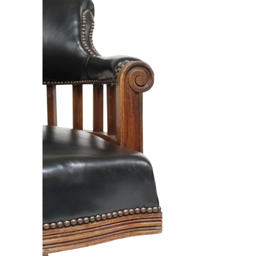 2016 - AN EARLY 20TH CENTURY BEECH FRAMED CAPTAINS STYLE SWIVEL DESK CHAIR&nbsp;with black Rexine upholster... 