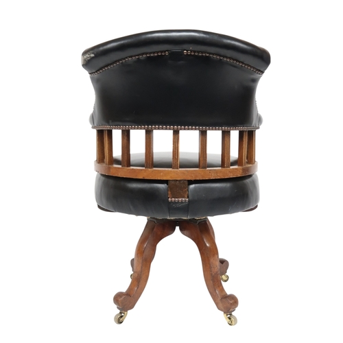2016 - AN EARLY 20TH CENTURY BEECH FRAMED CAPTAINS STYLE SWIVEL DESK CHAIR&nbsp;with black Rexine upholster... 