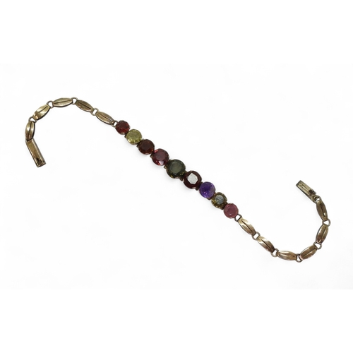 2752 - A RAINBOW GEM STONE BRACELETmounted in yellow metal and set with colourful gemstones to include garn... 