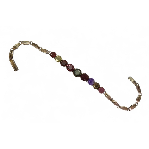 2752 - A RAINBOW GEM STONE BRACELETmounted in yellow metal and set with colourful gemstones to include garn... 
