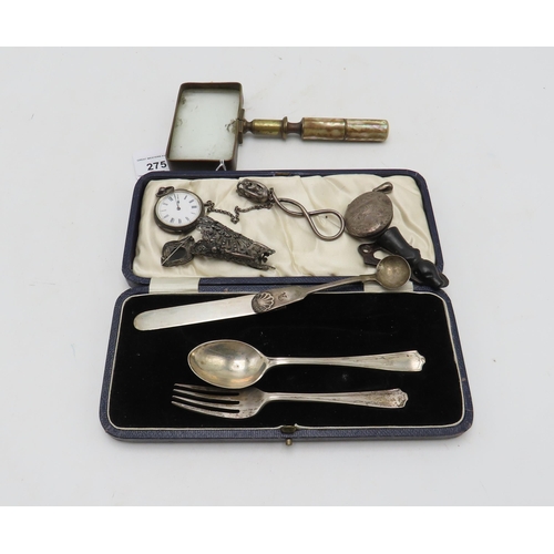 275 - A cased silver eating set, by Martin Hall & Co, Sheffield, a silver locket, Birmingham, a Scotti... 