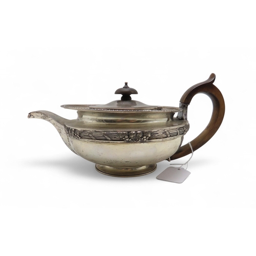277 - An Edwardian silver teapot, by C S Harris & Sons Ltd, London 1906, of squat baluster form, crest... 