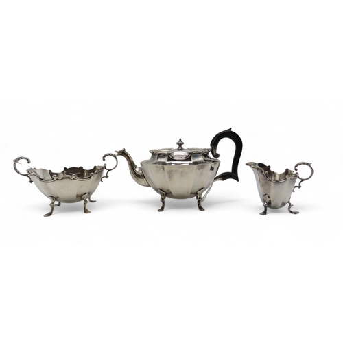 279 - A bachelor's silver tea service, by Henry Matthews, Birmingham 1900, of faceted form, with an ebonis... 