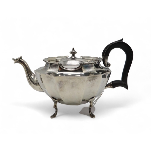 279 - A bachelor's silver tea service, by Henry Matthews, Birmingham 1900, of faceted form, with an ebonis... 