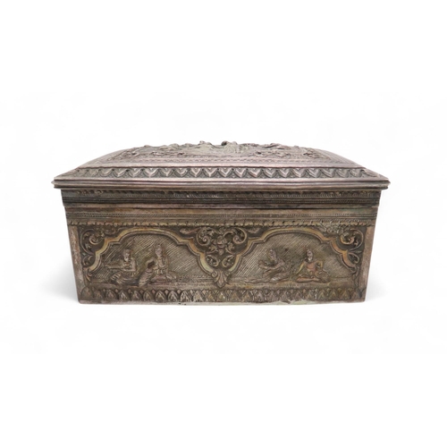 282 - A Burmese silver jewellery box, of rectangular form, decorated in repousse with figures within lands... 
