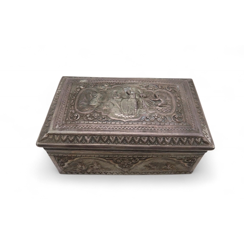 282 - A Burmese silver jewellery box, of rectangular form, decorated in repousse with figures within lands... 