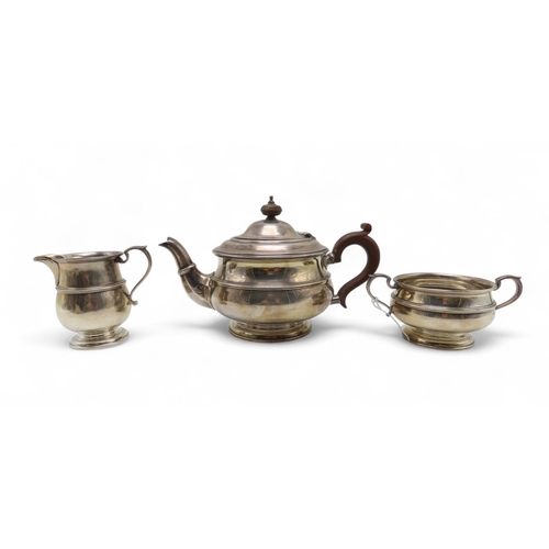 284 - A Scottish three piece silver tea service, by Hamilton & Inches, Edinburgh 1922, of baluster for... 