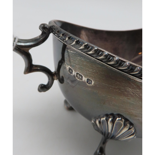 290 - A silver sauceboat, by William Hutton & Sons, Sheffield, with a flying scroll handle, a part cru... 