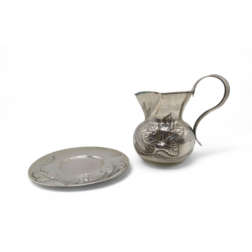 293 - An Italian silver jug and stand, embossed with grape & vine decoration, 674gms (2)