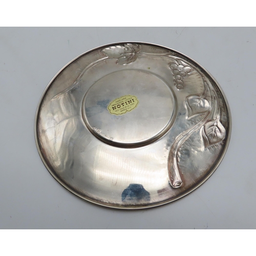 293 - An Italian silver jug and stand, embossed with grape & vine decoration, 674gms (2)