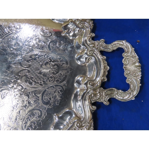 306 - A large and impressive Victorian EPNS twin-handled serving tray, with a rocaille scrollwork border, ... 