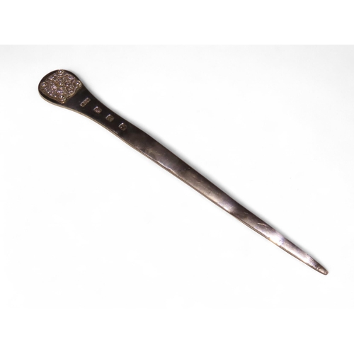299A - A Scottish silver letter opener, possibly Lawrence R Watson & Co, Edinburgh 1951, the finial wit... 