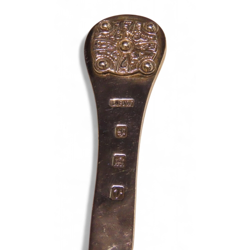 299A - A Scottish silver letter opener, possibly Lawrence R Watson & Co, Edinburgh 1951, the finial wit... 