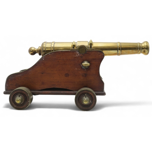 2550 - A BRASS MARITIME SIGNAL CANNONMounted upon a hardwood carriage, the barrel measuring approx. 59cm fr... 