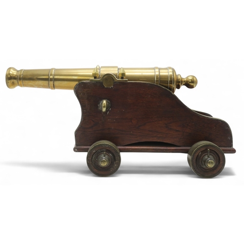 2550 - A BRASS MARITIME SIGNAL CANNONMounted upon a hardwood carriage, the barrel measuring approx. 59cm fr... 