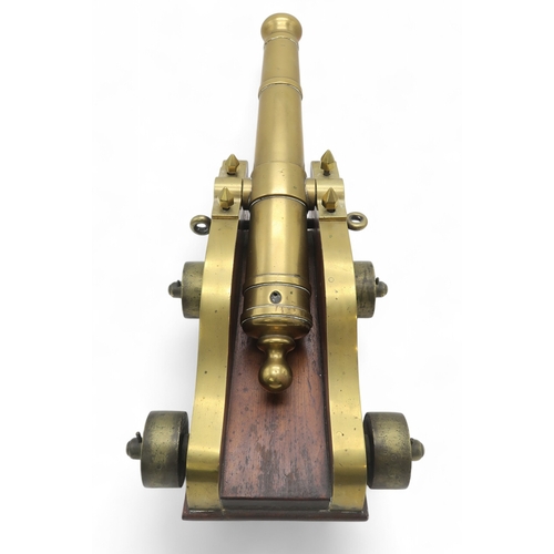 2550 - A BRASS MARITIME SIGNAL CANNONMounted upon a hardwood carriage, the barrel measuring approx. 59cm fr... 