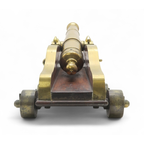 2550 - A BRASS MARITIME SIGNAL CANNONMounted upon a hardwood carriage, the barrel measuring approx. 59cm fr... 