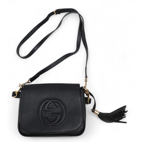 6119 - Gucci - A leather cross body bag, a leather shoulder bag with stitched logo to front, a canvas body ... 