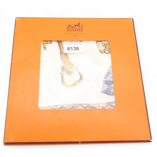 6136 - A Hermes ladies scarf decorated with keys, in box