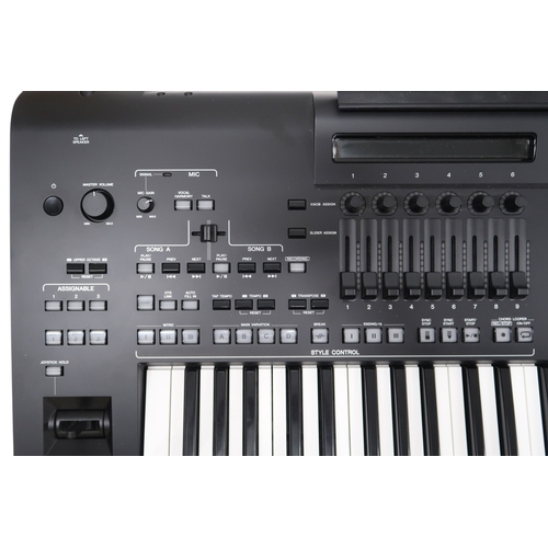 2604 - A YAMAHA GENOS2 76-KEY ARRANGER WORKSTATION KEYBOARD with an instruction manual and CD, and a Yamaha... 
