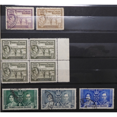 7153 - JAMAICA, TURKS & CAICOS ISLANDS a collection on 7 stock book pages with JAMAICA 1870 1/- and 2/-... 