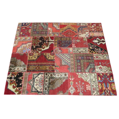 A IRREGULAR MULTICOLOURED PATCHWORK RUG constructed of multiple ...