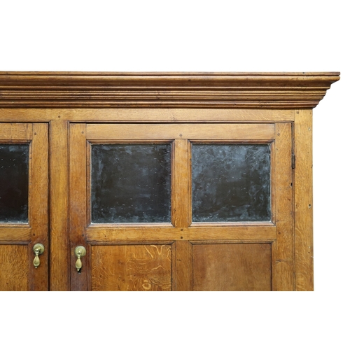 2036 - A LATE 19TH/EARLY 20TH CENTURY BLONDE OAK LARDER CABINETwith moulded cornice top over pair of glazed... 