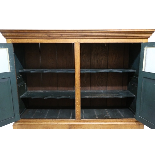 2036 - A LATE 19TH/EARLY 20TH CENTURY BLONDE OAK LARDER CABINETwith moulded cornice top over pair of glazed... 