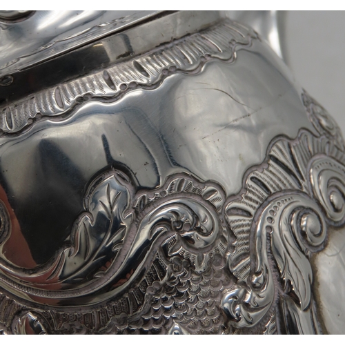 2301 - AN IMPRESSIVE GEORGE IV IRISH SILVER TEAPOTmaker's mark MF, Dublin 1820, of baluster form, engraved ... 