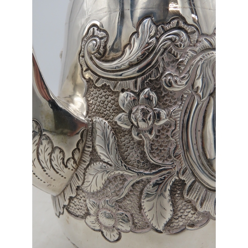 2301 - AN IMPRESSIVE GEORGE IV IRISH SILVER TEAPOTmaker's mark MF, Dublin 1820, of baluster form, engraved ... 