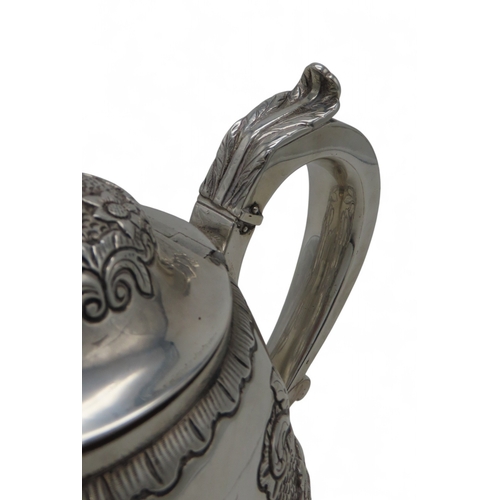 2301 - AN IMPRESSIVE GEORGE IV IRISH SILVER TEAPOTmaker's mark MF, Dublin 1820, of baluster form, engraved ... 