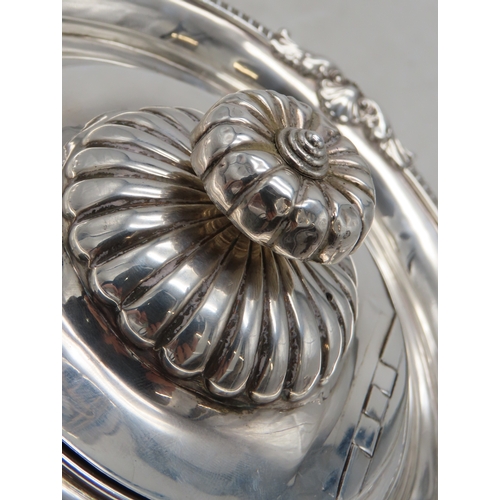 2302 - A GEORGE III IRISH SILVER TEAPOTby James Scott, Dublin 1814, of squat baluster form, the body part-f... 
