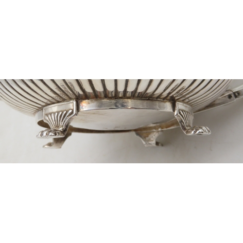 2302 - A GEORGE III IRISH SILVER TEAPOTby James Scott, Dublin 1814, of squat baluster form, the body part-f... 