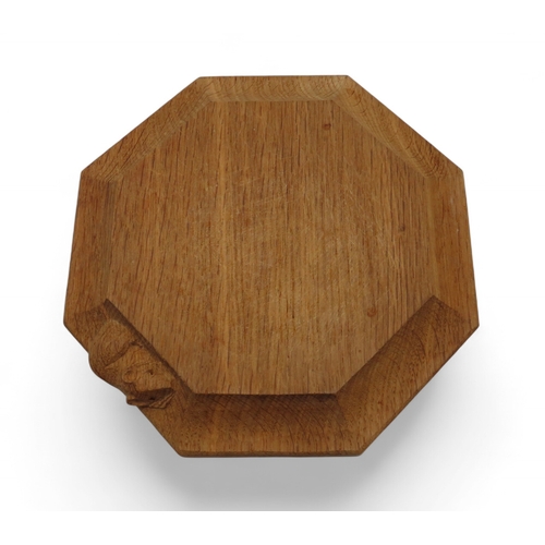 2153 - WORKSHOP OF ROBERT 'MOUSEMAN' THOMPSON, KILBURNoak octagonal chopping board, with carved mouse detai... 