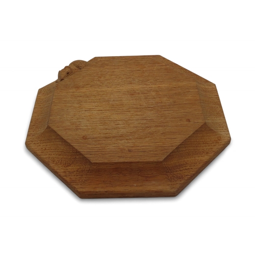 2153 - WORKSHOP OF ROBERT 'MOUSEMAN' THOMPSON, KILBURNoak octagonal chopping board, with carved mouse detai... 