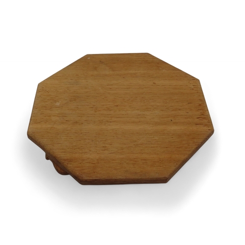 2153 - WORKSHOP OF ROBERT 'MOUSEMAN' THOMPSON, KILBURNoak octagonal chopping board, with carved mouse detai... 