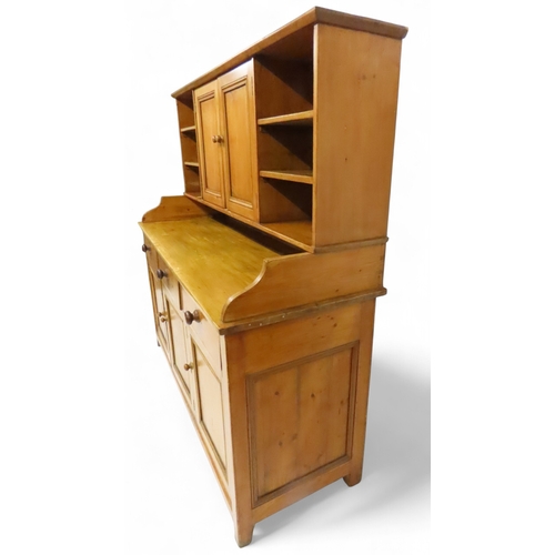 2003 - A 19TH CENTURY SCOTTISH PINE FARM HOUSE KITCHEN DRESSERwith central pair of cabinet doors flanked by... 