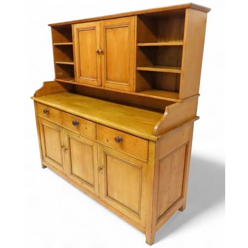 2003 - A 19TH CENTURY SCOTTISH PINE FARM HOUSE KITCHEN DRESSERwith central pair of cabinet doors flanked by... 