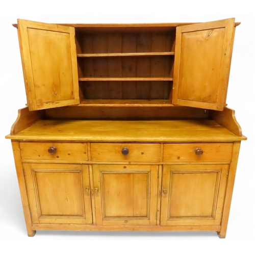 2003 - A 19TH CENTURY SCOTTISH PINE FARM HOUSE KITCHEN DRESSERwith central pair of cabinet doors flanked by... 