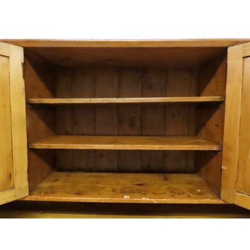 2003 - A 19TH CENTURY SCOTTISH PINE FARM HOUSE KITCHEN DRESSERwith central pair of cabinet doors flanked by... 