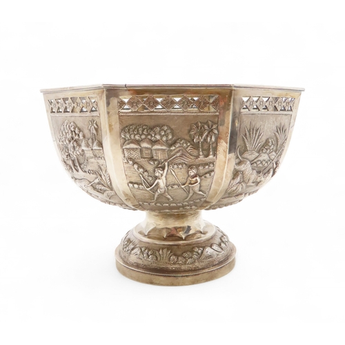 2263 - A CALCUTTA WHITE METAL OCTAGONAL ROSE BOWLDecorated with panels of hunting scenes, beneath pierced d... 