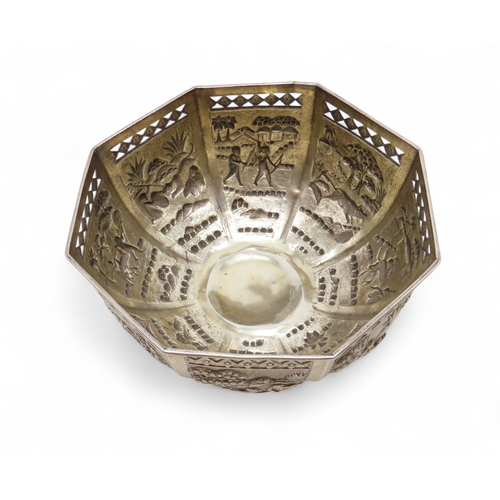 2263 - A CALCUTTA WHITE METAL OCTAGONAL ROSE BOWLDecorated with panels of hunting scenes, beneath pierced d... 