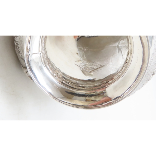 2264 - A CALCUTTA WHITE METAL TEAPOTWith matching cream jug and an associated sugar bowl, the teapot and cr... 