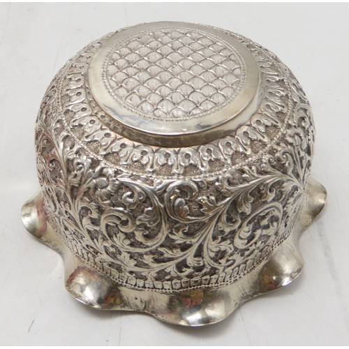 2264 - A CALCUTTA WHITE METAL TEAPOTWith matching cream jug and an associated sugar bowl, the teapot and cr... 