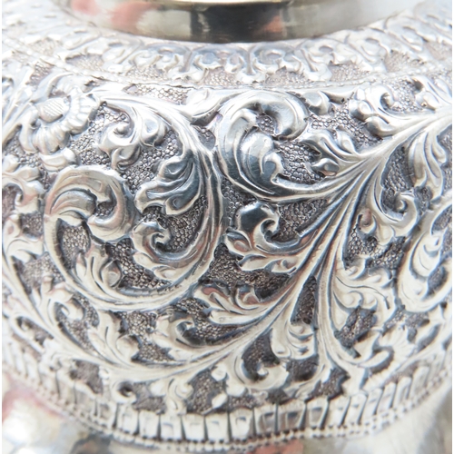 2264 - A CALCUTTA WHITE METAL TEAPOTWith matching cream jug and an associated sugar bowl, the teapot and cr... 